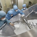 NANTONG, CHINA - FEBRUARY 27 2020: Employees work on the production line of chloroquine phosphate, resumed after a 15-year break, in a pharmaceutical company in Nantong city in east China's Jiangsu province Thursday, Feb. 27, 2020. Chloroquine phosphate, an old drug for the treatment of malaria, has shown some efficacy and acceptable safety against COVID-19 associated pneumonia in trials, according to Chinese media.