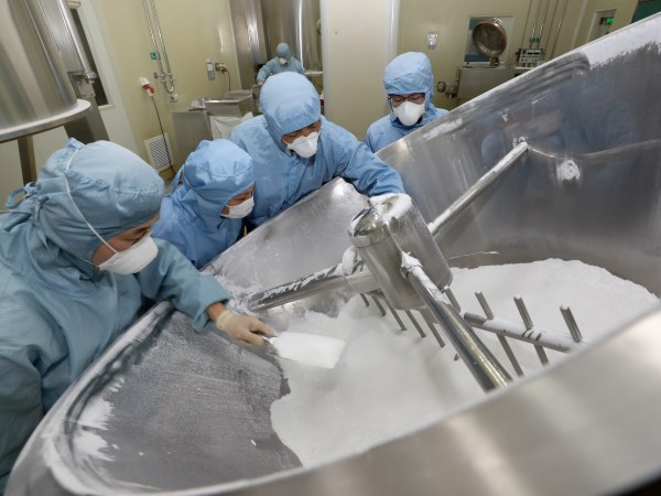 NANTONG, CHINA - FEBRUARY 27 2020: Employees work on the production line of chloroquine phosphate, resumed after a 15-year break, in a pharmaceutical company in Nantong city in east China's Jiangsu province Thursday, Feb. 27, 2020. Chloroquine phosphate, an old drug for the treatment of malaria, has shown some efficacy and acceptable safety against COVID-19 associated pneumonia in trials, according to Chinese media.