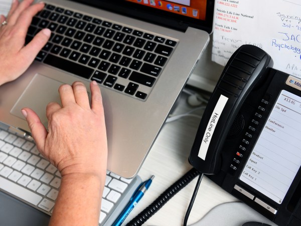 CHEVY CHASE, MD - MARCH 18:Sue-Ann Siegel logs in a summary of a call to the Montgomery County Hotline from her home office March 18, 2020 in Chevy Chase, MD. The covid-19 pandemic has led to a big spike in calls to mental health and suicide prevention hotlines. (Photo by Katherine Frey/The Washington Post)