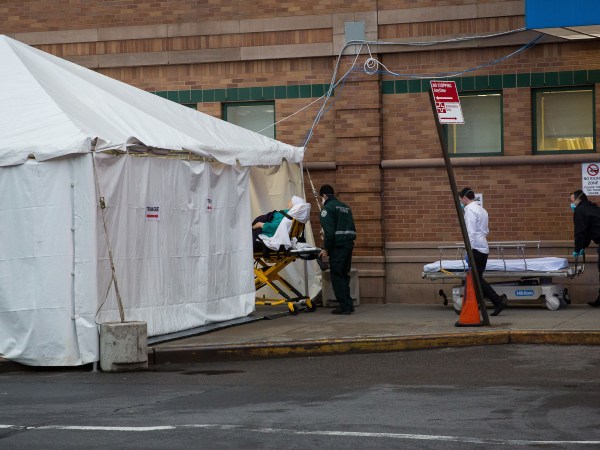 NEW YORK, March 29, 2020 -- A patient is transferred to Maimonides Medical Center in Brooklyn of New York, the United States, March 28, 2020. The confirmed cases in the United States have exceeded 122,000 as of Saturday night, up from about 101,600 of the previous day, with reports of more than 2,000 deaths, according to the tally from Johns Hopkins University's Center for Systems Science and Engineering. (Photo by Michael Nagle/Xinhua via Getty)