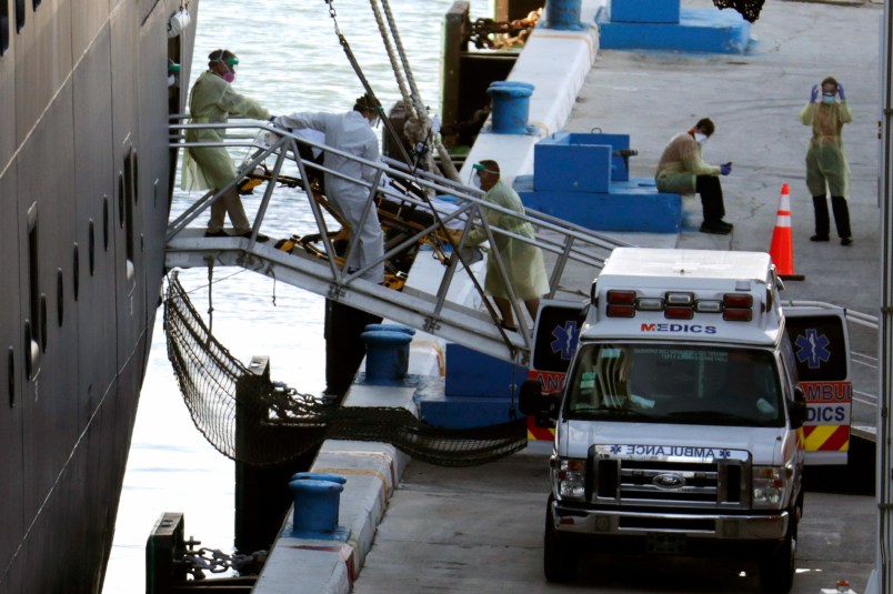 A person on a stretcher is removed from Carnaval’s Holland America cruise ship Zaandam at Port Everglades during the new coronavirus pandemic, Thursday, April 2, 2020, in Fort Lauderdale, Fla. Those passengers that are fit for travel in accordance with guidelines from the U.S. Centers for Disease Control will be permitted to disembark. (AP Photo/Lynne Sladky)