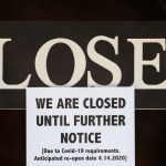 A notice of closure is posted at The Great Frame Up in Grosse Pointe Woods, Mich., Thursday, April 2, 2020. The coronavirus COVID-19 outbreak has triggered a stunning collapse in the U.S. workforce with 10 million people losing their jobs in the past two weeks and economists warn unemployment could reach levels not seen since the Depression, as the economic damage from the crisis piles up around the world. (AP Photo/Paul Sancya)