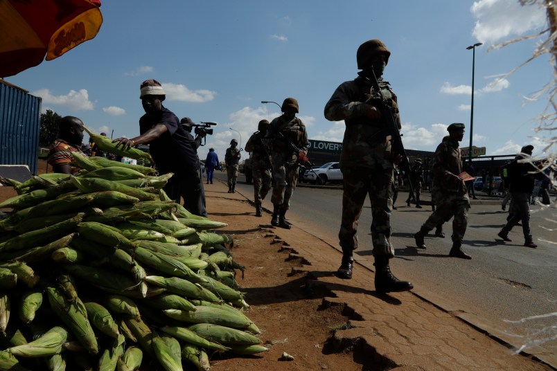 Soldiers patrol the streets of Soweto, South Africa, Thursday, April 23, 2020 as the country remains in lockdown for a fourth week  in a bid to combat the spread of the coronavirus. Africa has registered a 43% jump in reported COVID-19 cases in the last week, highlighting a warning from the World Health Organization that the continent of 1.3 billion could become the next epicenter of the global outbreak(AP Photo/Themba Hadebe)