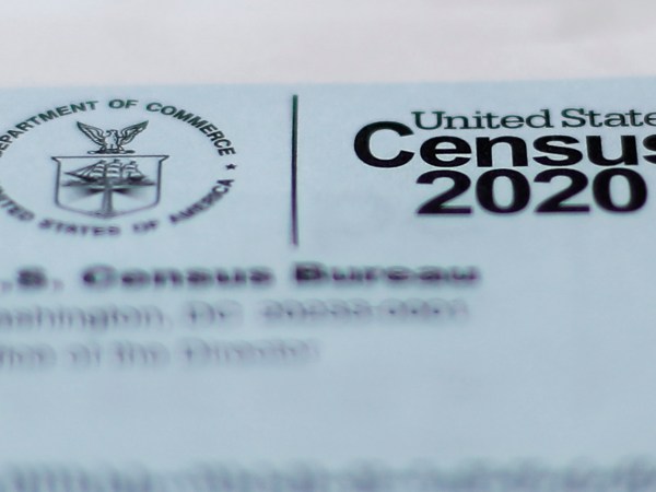 A 2020 census letter mailed to a U.S. resident, is shown in Detroit, Sunday, April 5, 2020. The Census Bureau is required by federal statute to send the president the counts that will be used to carve up congressional districts — known as apportionment — and draw state legislative districts by Dec. 31. The new coronavirus COVID-19 spread forced the U.S. Census Bureau to suspend field operations (AP Photo/Paul Sancya)