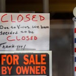 A For Sale By Owner and closed due virus sign are shown at Images On Mack in Grosse Pointe Woods, Mich., Thursday, April 2, 2020. The coronavirus COVID-19 outbreak has triggered a stunning collapse in the U.S. workforce with 10 million people losing their jobs in the past two weeks and economists warn unemployment could reach levels not seen since the Depression, as the economic damage from the crisis piles up around the world. (AP Photo/Paul Sancya)