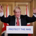 FILE - In this Sunday March 22, 2020 file photo British Prime Minister Boris Johnson gestures during his daily COVID 19 coronavirus press briefing to announce new measures to limit the spread of the virus, at Downing Street in London. The British prime minister’s office says Boris Johnson will return to work Monday April 27, 2020, two weeks after he was discharged from a London hospital where he was treated for the new coronavirus. (Ian Vogler / Pool via AP, File)