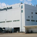 FILE - This Wednesday, April 8, 2020 file photo shows the Smithfield pork processing plant in Sioux Falls, S.D., where health officials reported dozens employees have confirmed cases of COVID-19. On Friday, April 17, 2020, The Associated Press reported on stories circulating online incorrectly asserting that the company's hogs will be raised in the U.S., but slaughtered and packaged for sale in China before being sent back. The false claim has been circulating online since 2014 after Smithfield Foods was sold to Chinese pork giant WH Group in 2013. Jenna Wollin, a spokeswoman for Smithfield Foods, told The Associated Press in an email that the claims circulating online were false. “No Smithfield products come from animals raised, processed, or packaged in China,” she said. (AP Photo/Stephen Groves)