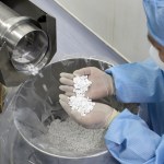 NANTONG, CHINA - FEBRUARY 27 2020: An employee checks the production of chloroquine phosphate, resumed after a 15-year break, in a pharmaceutical company in Nantong city in east China's Jiangsu province Thursday, Feb. 27, 2020. Chloroquine phosphate, an old drug for the treatment of malaria, has shown some efficacy and acceptable safety against COVID-19 associated pneumonia in trials, according to Chinese media.