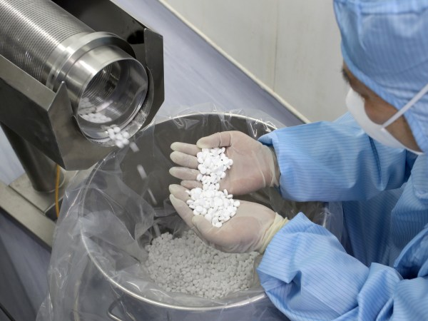 NANTONG, CHINA - FEBRUARY 27 2020: An employee checks the production of chloroquine phosphate, resumed after a 15-year break, in a pharmaceutical company in Nantong city in east China's Jiangsu province Thursday, Feb. 27, 2020. Chloroquine phosphate, an old drug for the treatment of malaria, has shown some efficacy and acceptable safety against COVID-19 associated pneumonia in trials, according to Chinese media.