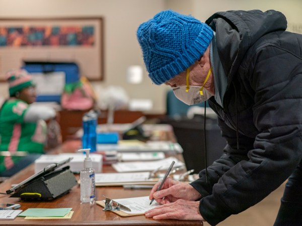 CHICAGO, IL - MARCH 17: Richard Rudberg casts ballots on Illinois' primary election day despite the COVID-19 pandemic in Chicago on March 17, 2020. (Photo by Youngrae Kim for The Washington Post)