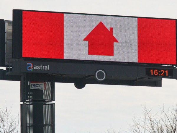 Sign with a Canadian flag (the maple leaf has been replaced with the symbol of a house) urging Canadians to stay at home to slow the spread of the novel coronavirus (COVID-19)in Vaughan, Ontario, Canada on April 12, 2020. The Ontario provincial government extended the state of emergency until April 23 due to the COVID-19 outbreak on Saturday. (Photo by Creative Touch Imaging Ltd./NurPhoto)