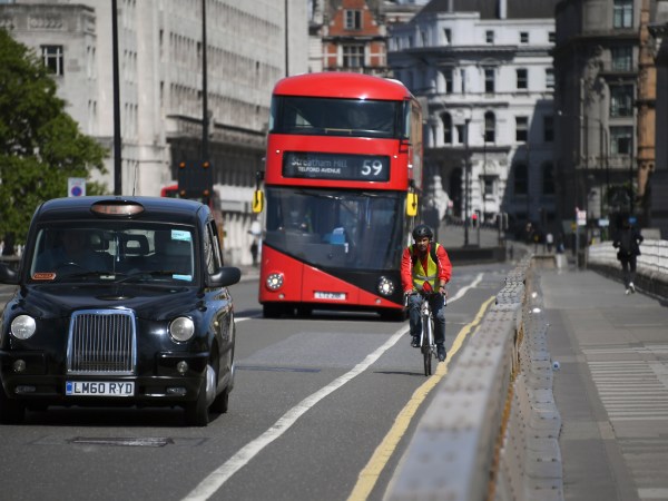 A cyclist rides his bike along Waterloo Bridge, in London, Monday, May 18, 2020. Large areas of London are to be closed to cars and vans to allow people to walk and cycle safely as the coronavirus lockdown is eased, including Waterloo Bridge and London Bridge. (AP Photo/Alberto Pezzali)