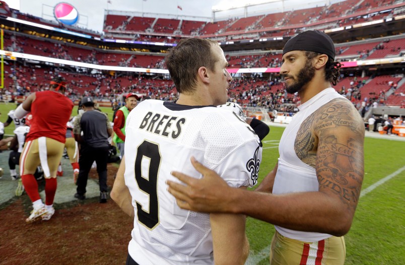 San Francisco 49ers quarterback Colin Kaepernick, right, is greeted by New Orleans Saints quarterback Drew Brees at the end of an NFL football game Sunday, Nov. 6, 2016, in Santa Clara, Calif. New Orleans won the game. (AP Photo/D. Ross Cameron)