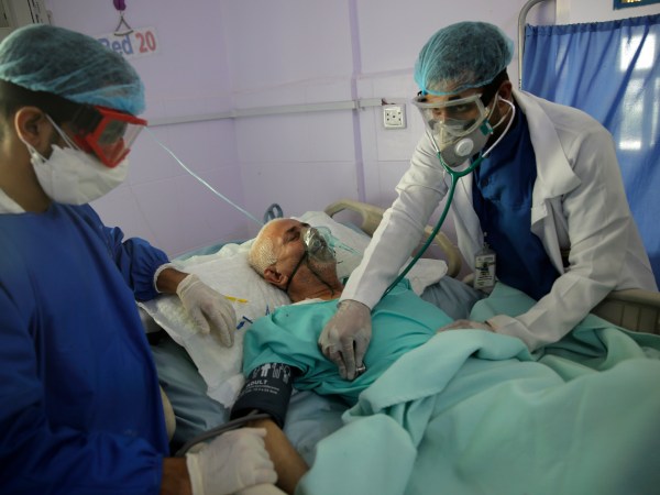 Medical workers attend a patient in an intensive care unit at a hospital for the coronavirus disease COVID-19 in Sanaa, Yemen, Sunday, Jun. 14, 2020. (AP Photo/Hani Mohammed)