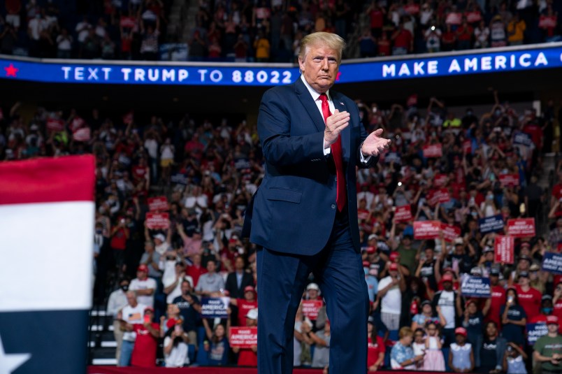 President Donald Trump arrives on stage to speak at a campaign rally at the BOK Center, Saturday, June 20, 2020, in Tulsa, Okla. (AP Photo/Evan Vucci)