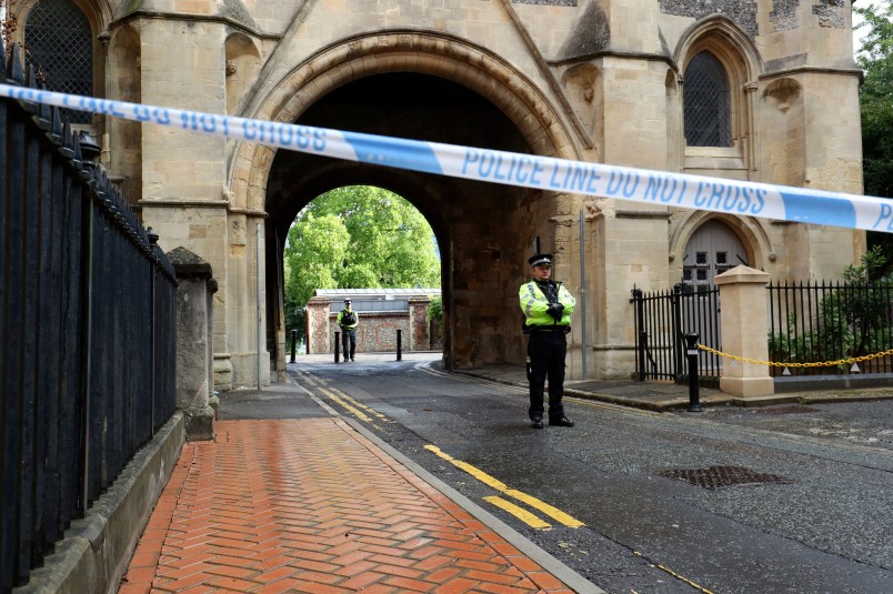 Police at the Abbey gateway of Forbury Gardens in Reading town centre following a multiple stabbing attack in the gardens which took place at around 7pm on Saturday leaving three people dead and another three seriously injured. PA Photo. Picture date: Sunday June 21, 2020. Police said a 25-year-old man from Reading was arrested at the scene on suspicion of murder and is currently in custody. Officers added the incident is not currently being treated as terror-related and they are not looking for anyone else following the attack. See PA story POLICE Reading. Photo credit should read: Jonathan Brady/PA Wire