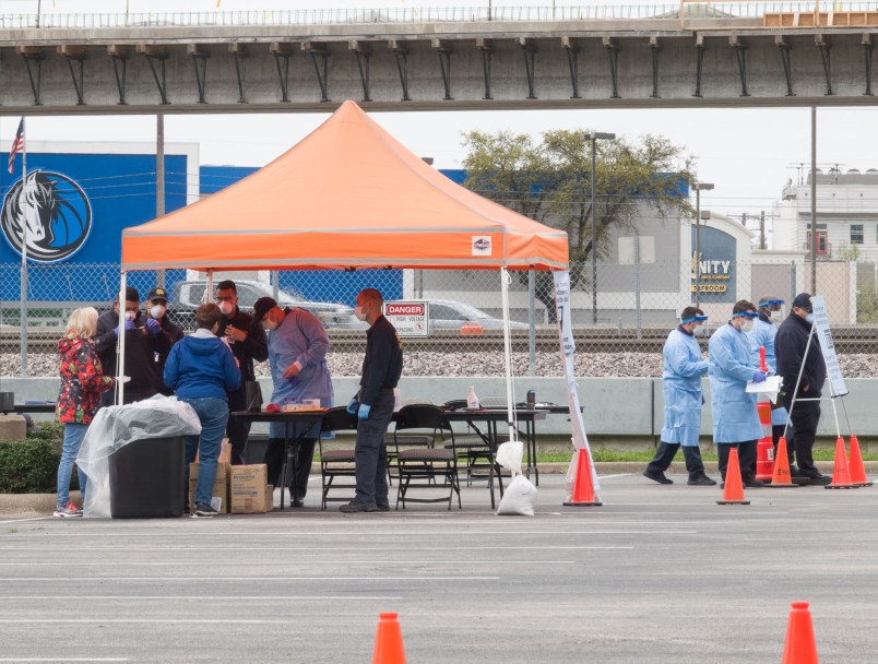 DALLAS, March 22, 2020 . Medical workers work at a drive-through COVID-19 testing site in Dallas, Texas, the United States, March 21, 2020. The number of COVID-19 cases in the United States topped 20,000 as of 1:30 p.m. Eastern Standard Time on Saturday ,1730 GMT, according to the Center for Systems Science and Engineering ,CSSE, at Johns Hopkins University. (Photo by Dan Tian/Xinhua via Getty)