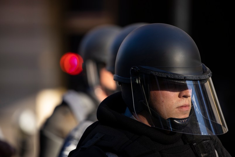 LOUISVILLE, KY - MAY 30:  Police officers in riot gear mobilize towards the park where protestors were gathered at on May 30, 2020 in Louisville, Kentucky. Protests have erupted after recent police-related incidents resulting in the deaths of African-Americans Breonna Taylor in Louisville and George Floyd in Minneapolis, Minnesota. (Photo by Brett Carlsen/Getty Images)
