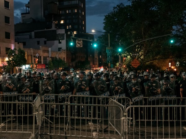 NEW YORK, NY - JUNE 02: NYPD officers block the exit of the Manhattan Bridge as hundreds protesting police brutality and systemic racism attempt to cross into the borough of Manhattan from Brooklyn hours after a citywide curfew went into effect in New York City. Days of protest, sometimes violent, have followed in many cities across the country in response to the death of George Floyd while in police custody in Minneapolis, Minnesota on May 25th. (Photo by Scott Heins/Getty Images)
