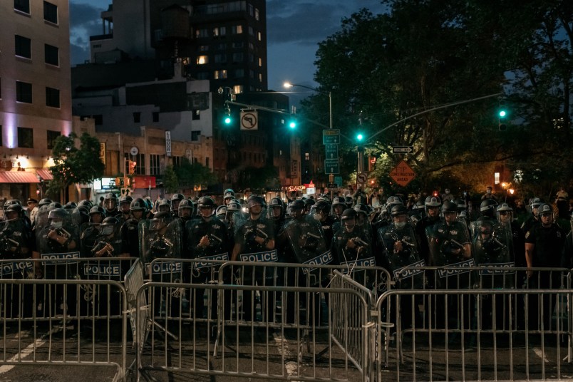 NEW YORK, NY - JUNE 02: NYPD officers block the exit of the Manhattan Bridge as hundreds protesting police brutality and systemic racism attempt to cross into the borough of Manhattan from Brooklyn hours after a citywide curfew went into effect in New York City. Days of protest, sometimes violent, have followed in many cities across the country in response to the death of George Floyd while in police custody in Minneapolis, Minnesota on May 25th. (Photo by Scott Heins/Getty Images)