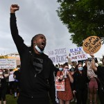 Erick Valerio, of Ronkonkoma, shouts before protestors walk down Old Country Road from Westbury towards Garden City in the death of George Floyd, Saturday, June 6, 2020.