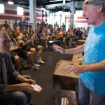 WASHINGTON, DC - JULY 31:    Crossfit Inc. founder and CEO Greg Glassman (R) talks to employees prior to a presentation at the half street location in Washington, DC on July 31, 2015.  CrossFit is waging a war against new DC rules to regulate personal trainers, saying D.C. is a pawn in a commercial fight over personal fitness.  The city council is proposing licensure and regulation of personal trainers.  There is a fee involved.  If the law should pass, DC would be the first municipality in the nation to do so.  Crossfit Inc. officials are fighting the proposed law and say that they are trying to legislate something that they do not understand.   (Photo by Linda Davidson / The Washington Post)
