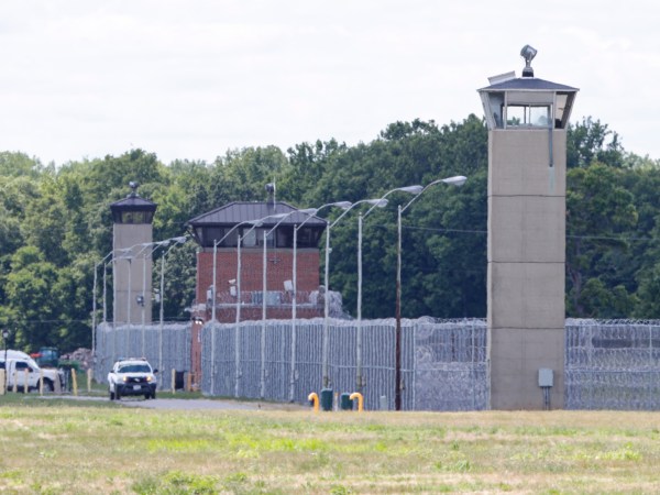Office patrol the grounds of the federal prison in Terre Haute, Ind., is shown Monday, July 13, 2020. Daniel Lewis Lee, a convicted killer, was scheduled to be executed at 4 p.m. in the . He was convicted in Arkansas of the 1996 killings of gun dealer William Mueller, his wife, Nancy, and her 8-year-old daughter, Sarah Powell. (AP Photo/Michael Conroy)