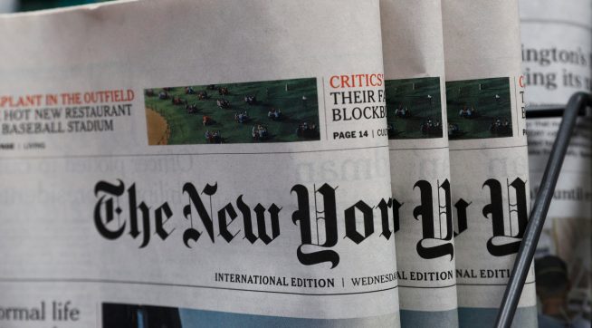 The New York Times newspaper are displayed for sale at a news stand in Hong Kong, Wednesday, July 15, 2020. The New York Times said Tuesday it will transfer some of its staff out of Hong Kong because of the uncertainties about practicing journalism in the Chinese territory under its newly imposed national security law. (AP Photo/Kin Cheung)