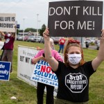 Protesters against the death penalty gather in Terre Haute, Ind., Wednesday, July 15, 2020. Wesley Ira Purkey, convicted of a gruesome 1998 kidnapping and killing, is scheduled to be executed Wednesday evening at the federal prison in Terre Haute.  (AP Photo/Michael Conroy)