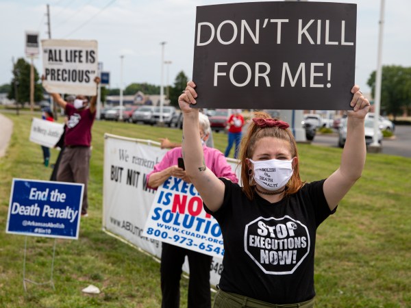 Protesters against the death penalty gather in Terre Haute, Ind., Wednesday, July 15, 2020. Wesley Ira Purkey, convicted of a gruesome 1998 kidnapping and killing, is scheduled to be executed Wednesday evening at the federal prison in Terre Haute.  (AP Photo/Michael Conroy)