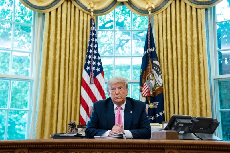 President Donald Trump listens during a meeting with Senate Majority Leader Mitch McConnell of Ky., and House Minority Leader Kevin McCarthy of Calif., in the Oval Office of the White House, Monday, July 20, 2020, in Washington. (AP Photo/Evan Vucci)