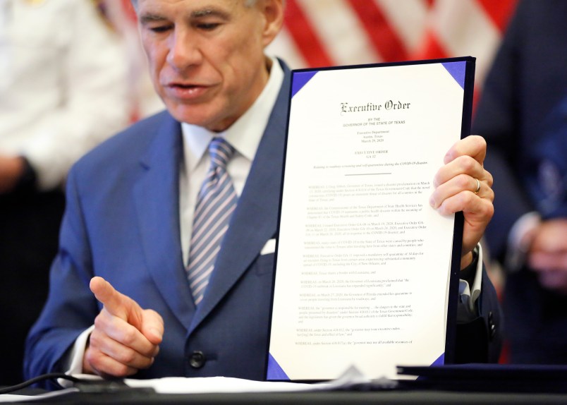 During a press conference at the Texas State Capitol in Austin, Texas Governor Greg Abbott holds a new executive order stating travel by road from any location in the state of Louisiana into Texas will require 14-day self quarantine, Sunday, March 29, 2020.  He also announced the US Army Corps of Engineers and the state are putting up a 250-bed field hospital at the Kay Bailey Hutchison Convention Center in downtown Dallas The space can expand to nearly 1,400 beds. (Tom Fox/The Dallas Morning News/Pool)