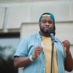 BLOOMINGTON, INDIANA, UNITED STATES - 2020/07/06: Vauhxx Booker, blue shirt, speaks during a community gathering to fight against racism.Protesters are demanding justice for Vauhxx Booker, who was allegedly attacked at Lake Monroe on Saturday the 4th of July 2020. (Photo by Jeremy Hogan/SOPA Images/LightRocket via Getty Images)