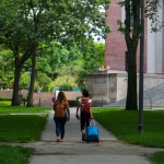 Two students are seen leaving their campus with baggage at Harvard University premises in Cambridge, MA, July 08, 2020. (Photo by Anik Rahman/NurPhoto)