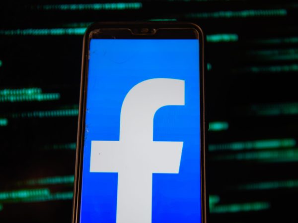 POLAND - 2020/07/15: In this photo illustration a Facebook logo is seen displayed on a smartphone with an European Union flag background. (Photo Illustration by Omar Marques/SOPA Images/LightRocket via Getty Images)