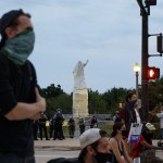 Activists stand at South Columbus Drive and East Roosevelt Road near the Christopher Columbus statue in Chicago on July 20, 2020. (Armando L. Sanchez/Chicago Tribune/TNS)