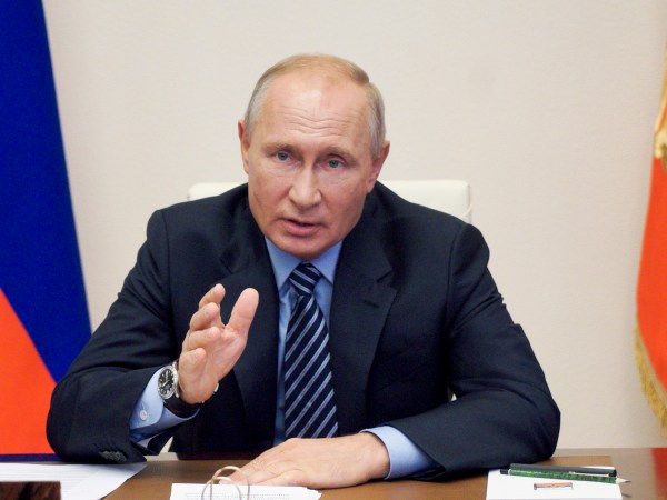 FILE  In this file photo taken on Thursday, July  9, 2020, Russian President Vladimir Putin gestures during a video conference meeting at the Novo-Ogaryovo residence outside Moscow in Moscow, Russia. Putin says that a coronavirus vaccine developed in the country has been registered for use and one of his daughters has already been inoculated. Speaking at a government meeting Tuesday, Putin said that the vaccine has proven efficient during tests, offering a lasting immunity from the coronavirus. (Alexei Druzhinin, Sputnik, Kremlin Pool Photo via AP, File)