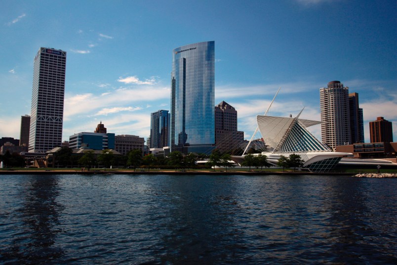 ***HOLD FOR MONDAY***This Aug. 13, 2020 photo shows the skyline of downtown Milwaukee, the location of a scaled down Democratic National Convention. About 50,000 visitors were expect to inject about $250 million into the economy of the key presidential battleground state.  But now, thanks to the ongoing coronavirus pandemic, the convention is nearly entirely online, with all of the major speakers, including presumptive nominee Joe Biden, skipping the trip to Milwaukee. It would have been the first time Milwaukee, a city of 1.6 million, hosted a presidential nominating convention. (AP Photo/Carrie Antlfinger)