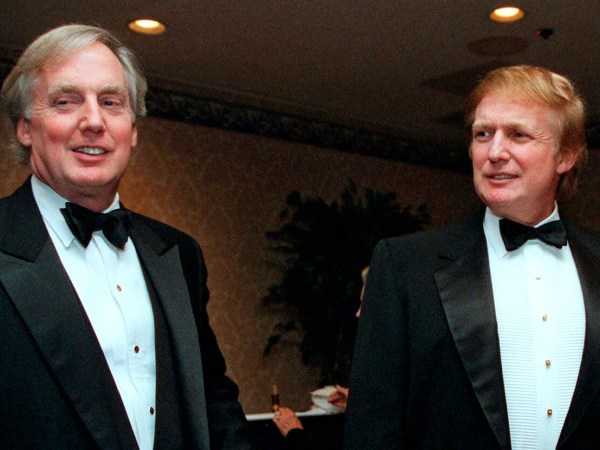 FILE - In this Nov. 3, 1999 file photo, Robert Trump, left, joins real estate developer and presidential hopeful Donald Trump at an event in New York. A tell-all book by President Donald Trump's niece cannot be published until a judge decides the merits of claims by the president's brother, her uncle Robert Trump, that its publication would violate a pact among family members, a judge said Tuesday, June 30, 2020. (AP Photo/Diane Bonadreff, File)