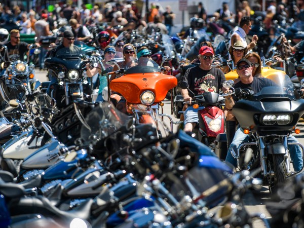 STURGIS, SD - AUGUST 07: Motorcyclists ride down Main Street during the 80th Annual Sturgis Motorcycle Rally on August 7, 2020 in Sturgis, South Dakota. While the rally usually attracts around 500,000 people, officials estimate that more than 250,000 people may still show up to this year's festival despite the coronavirus pandemic. (Photo by Michael Ciaglo/Getty Images)