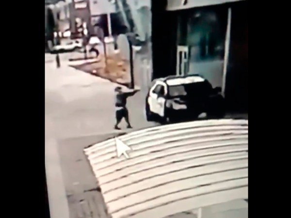 This image screen grab from a security camera video released the Los Angeles County Sheriff's Department shows a gunman walking up to Sheriff's deputies and opening fire without warning or provocation in Compton, Calif., on Saturday, Sept. 12, 2020. Officials say two Los Angeles County sheriff's deputies were shot in their patrol car at a Metro rail station in what appeared to be an ambush. The sheriff's department said the male and female deputies were shot in the head Saturday in Compton and had multiple gunshot wounds. Both were undergoing surgery. Video shared by the sheriff's department showed a suspect walk up to the vehicle and fire a handgun. The incident happened around 7 p.m. a short distance from the Compton sheriff’s station. Deputies were searching for a suspect. (Los Angeles County Sheriff's Department via AP)