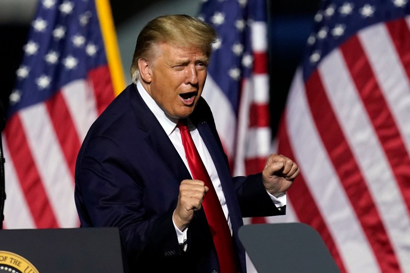 President Trump does a little dance as he leaves the stage during an airport rally Friday, Sept. 25, 2020, in Newport News, Va. (AP Photo/Steve Helber)