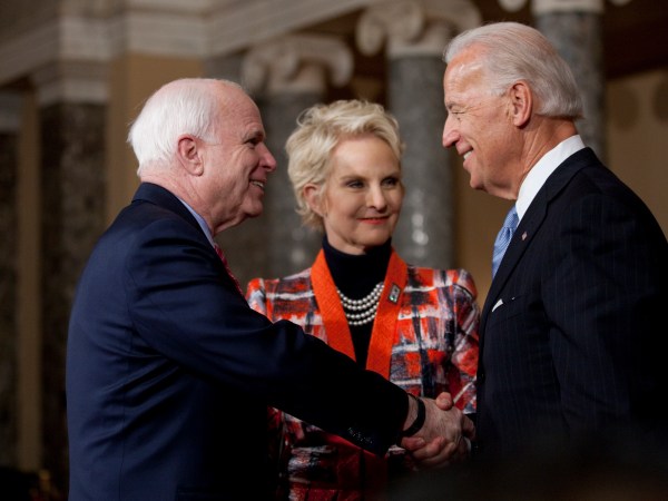 Sen. John McCain (R-AZ) participates in a reenactment of her swearing in ceremony with Vice President Joe Biden, inside the Old Senate Chamber on Capitol Hill in Washington, DC.  On the right is his wife Cindy.