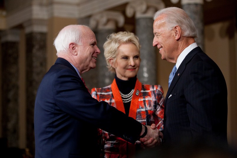 Sen. John McCain (R-AZ) participates in a reenactment of her swearing in ceremony with Vice President Joe Biden, inside the Old Senate Chamber on Capitol Hill in Washington, DC.  On the right is his wife Cindy.