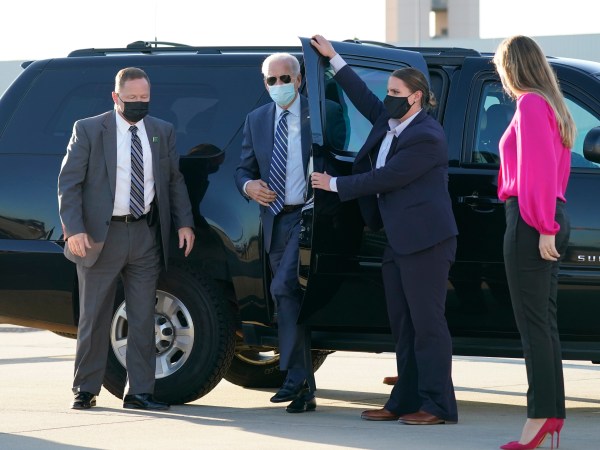 Democratic presidential candidate former Vice President Joe Biden steps out to board his campaign plane at Raleigh-Durham International Airport in Morrisville, N.C., Sunday, Oct. 18, 2020, en route to Wilmington, Del., as granddaughter Finnegan Biden looks on, right.  AP Photo/Carolyn Kaster)
