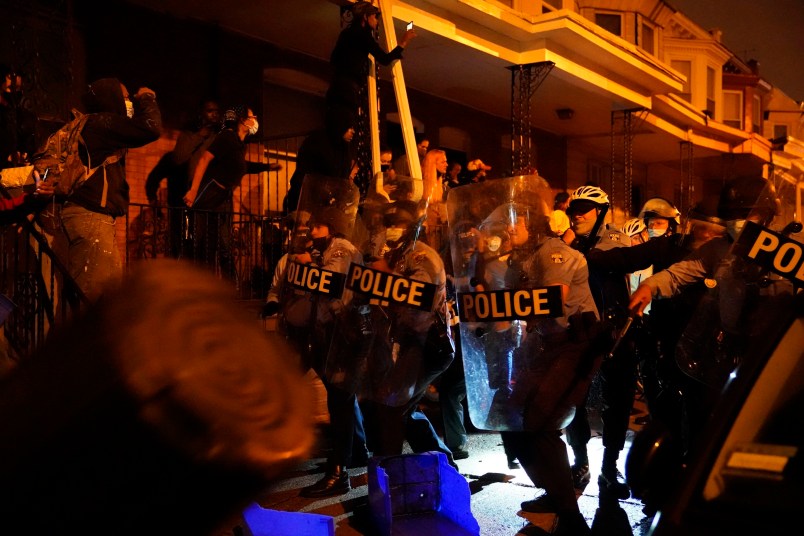 Police officers in formation during a protest in response to the police shooting of Walter Wallace Jr. on Monday, October 26, 2020 in Philadelphia, Pa. Police officers fatally shot the 27-year-old Black man during a confrontation Monday afternoon in West Philadelphia that quickly raised tensions in the neighborhood. Shortly before 4 p.m., two officers fired their guns at the man in the 6100 block of Locust Street. Police then transported the man to Penn Presbyterian Medical Center. He was later pronounced dead at the hospital. JESSICA GRIFFIN / The Philadelphia Inquirer