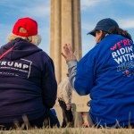 KANSAS CITY, MO - MARCH 07: A President Donald Trump and a former Vice President Joe Biden supporter converse before the Joe Biden Campaign Rally at the National World War I Museum and Memorial on March 7, 2020 in Kansas City, Missouri. (Photo by Kyle Rivas/Getty Images)