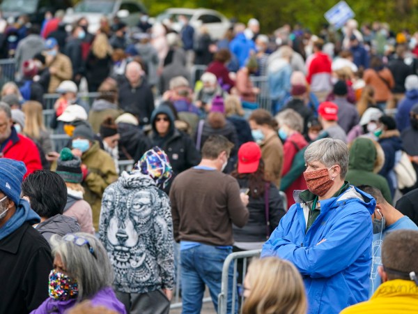 Voters wait in long lines to cast their ballots during early voting at St. Luke's United Methodist Church in Indianapolis, Wednesday, Oct. 28, 2020. The wait to vote was over 4 hours. (AP Photo/Michael Conroy)