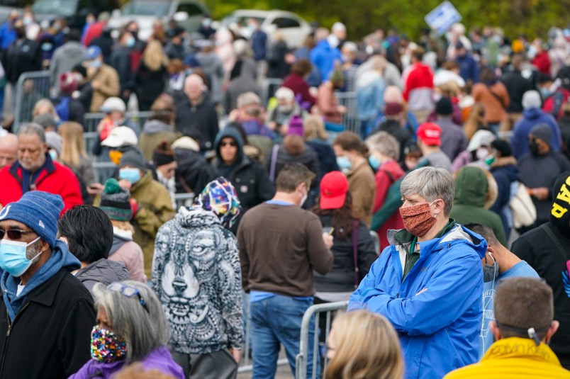 Voters wait in long lines to cast their ballots during early voting at St. Luke's United Methodist Church in Indianapolis, Wednesday, Oct. 28, 2020. The wait to vote was over 4 hours. (AP Photo/Michael Conroy)