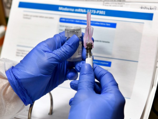 Registered Nurse Kath Olmstead prepares  a blinded study experimental vaccine for COVID-19 developed by the National Institutes of Health and Moderna Inc. at the United Health Services facility, Monday, July 27, 2020, in Binghamton, N.Y. (AP Photo/Hans Pennink